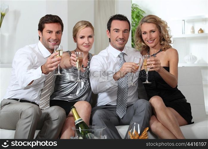 Couples drinking champagne