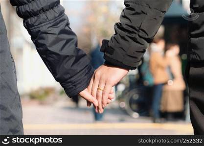 Couples holding hands in the winter season
