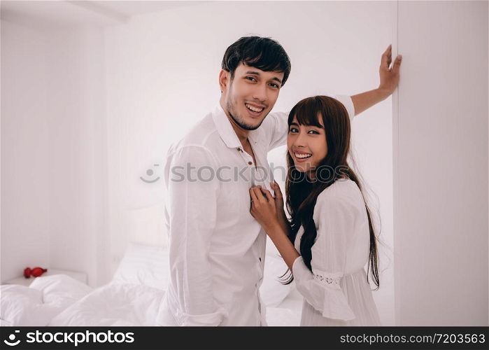 couples lover Laying On Bed room Happiness Lifestyle and smiling girl relaxing in white bed