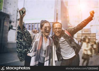 couples of asian traveller happiness emotion at dotonbori most popular traveling destination in osaka japan