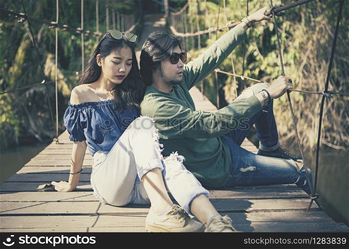 couples of asian younger man and woman pose for photography on location cinema color process