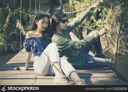 couples of asian younger man and woman pose for photography on location cinema color process