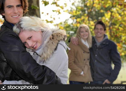 Couples strolling in the park