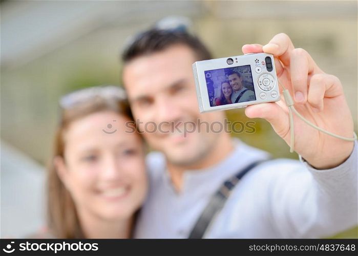 couplle taking selfie