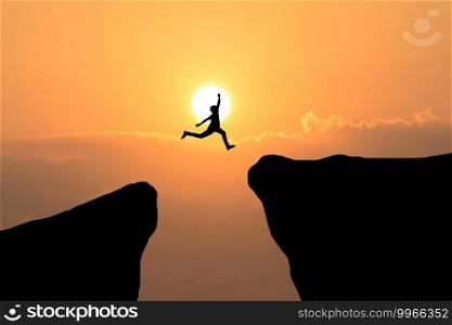 Courage man jump through the gap between hill ,Business concept idea