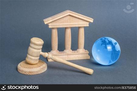 Courthouse, gavel and blue globe planet earth. International Court. Protection of business interests and human rights. international conventions and treaties. supreme