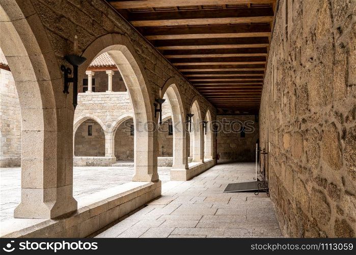 Courtyard or cloisters inside the palace of the Dukes of Braganza in Guimaraes in northern Portugal. Courtyard inside the palace of the Dukes of Braganza