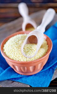 cous-cous in bowl and on a table