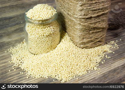 Couscous for a healthy diet on wooden background