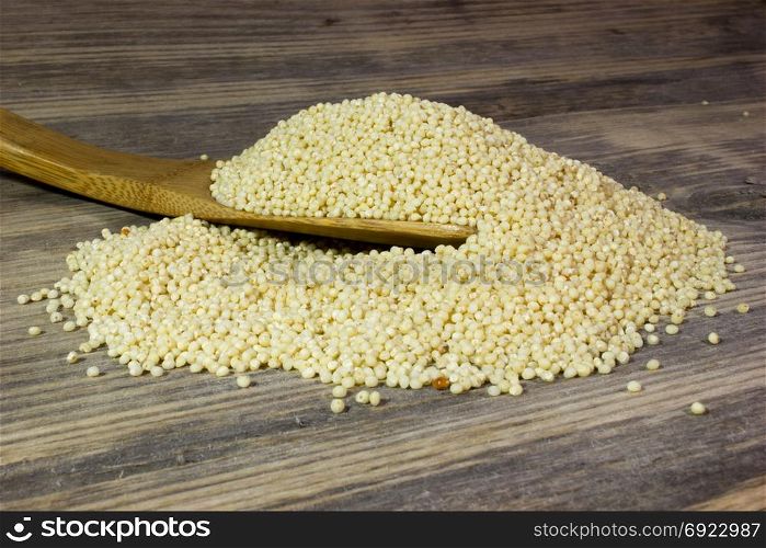 Couscous for a healthy diet on wooden background
