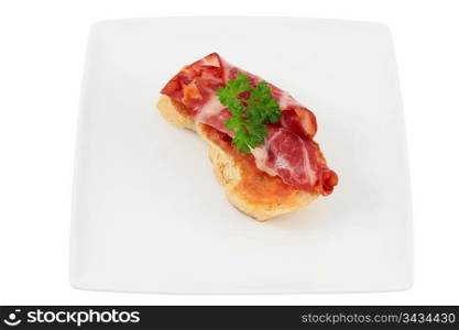 cover of bread with lomo tomato parsley and olive oil cut off and isolated