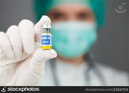 Covid-19 Coronavirus disease,global pandemic outbreak,scientist or doctor holding a vaccine&oule injection,cure for deadly Wuhan SARS-CoV-2 epidemic virus,groundbreaking solution contingency plan