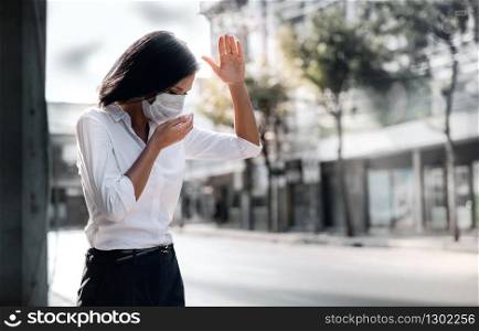 Covid-19 or Corona Virus or Air Pollution PM2.5 Situation Concept. Young Woman with Medical Mask Coughing in Public