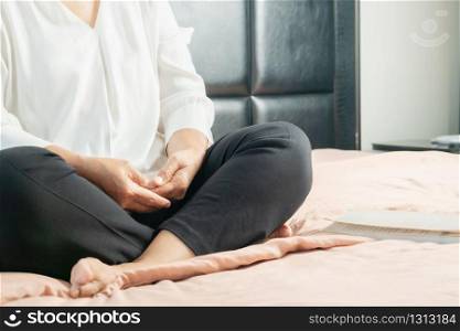 Covid-19 quarantine activity for senior woman meditating stay home to avoid risk