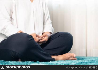 Covid-19 quarantine activity for senior woman meditating stay home to avoid risk