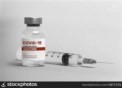 COVID-19 vaccine injection glass bottle with syringe