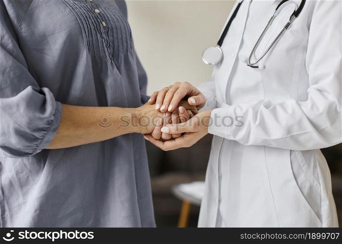 covid recovery center female doctor holding older patient s hands. Resolution and high quality beautiful photo. covid recovery center female doctor holding older patient s hands. High quality beautiful photo concept