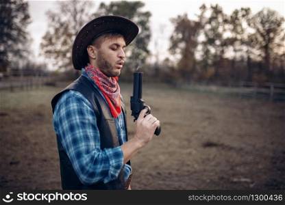 Cowboy with revolver wins gunfight, lucky strike on texas ranch, western. Vintage male person with gun, wild west adventure