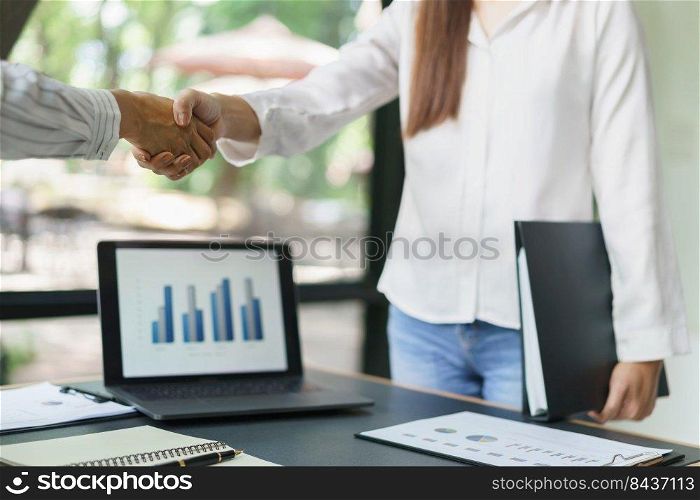 Coworker business concept, Two businesswoman shake hands after successfully discussing the project.
