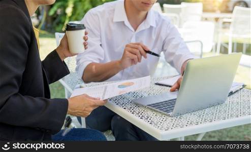 Coworking conference, Business team meeting present, investor executive colleagues discussing new plan financial graph data on outdoors office table with laptop and tablet, Finance, accounting