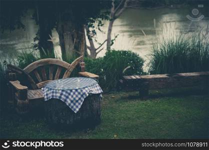 Cozy design chair and table in the garden; natural feeling