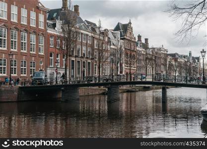 Cozy european architecture with river canal. Amsterdam beautiful houses