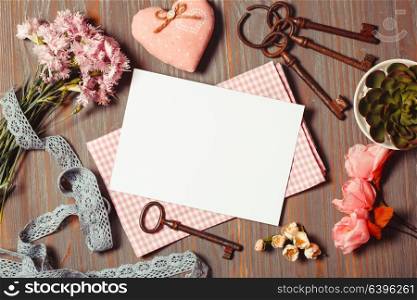 Cozy inspirated sings - old keys, flowers, fabric, lace and empty tag for painting or writing. Place for text