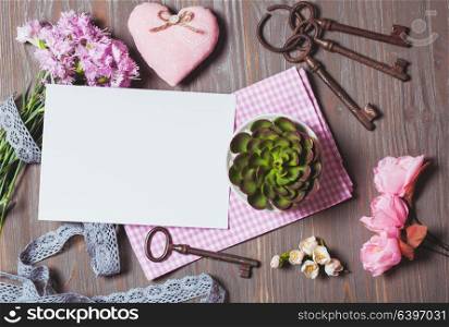 Cozy inspirated sings - old keys, flowers, fabric, lace and empty tag for painting or writing. Place for text