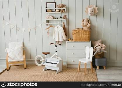 Cozy interior of a children’s room, a play area. Toys, a bicycle, a piano, a chest of drawers and clothes on a hanger. Scandinavian apartment style