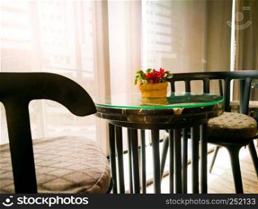 cozy wooden table with the red orchid