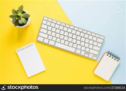 cozy workplace with keypad notebooks