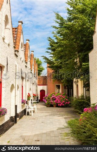 Cozy yard in ancient provincial European town. Traditional architecture. Summer tourism and travels, famous europe landmark, popular places for travelling
