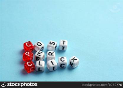 CPC Cost Per Click written on dices on blue