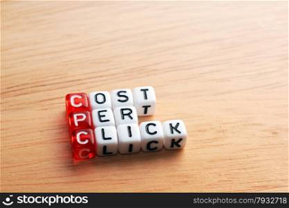 CPC Cost Per Click written on dices on wood