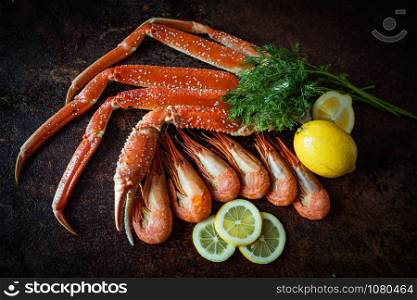 Crab legs on brown rustic background