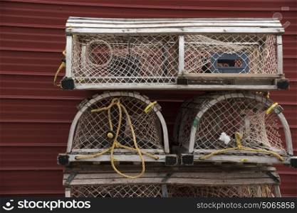 Crab pots stacked by wall, Souris, Kings County, Prince Edward Island, Canada