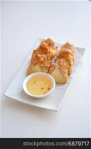 Crab Rangoon. Cream cheese, crab-meat, celery wrapped in thin crape and fried. Served with light sweet & sour sauce.