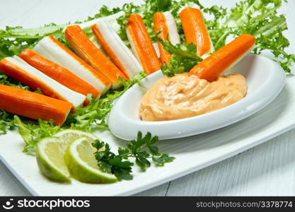 crab salad with fresh lettuce and cocktail sauce