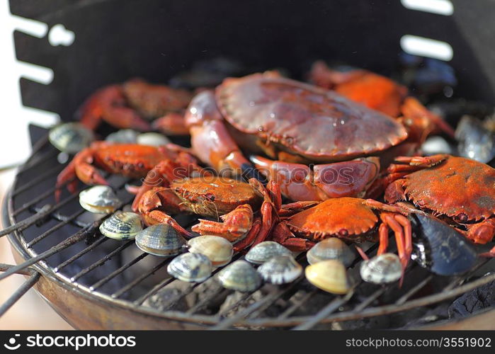 crabs shrimps on charcoal grill