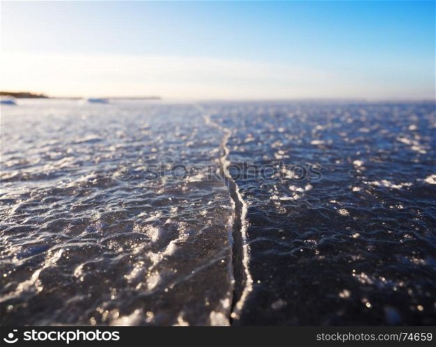 Crack in the ice, Gulf of Finland, near Saint Petersburg. Shallow depth of field.. Crack in the ice, Gulf of Finland, near Saint Petersburg. Shallow depth of field.