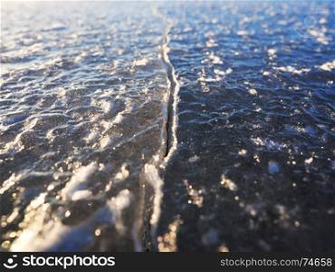 Crack in the ice, Gulf of Finland. Shallow depth of field.. Crack in the ice, Gulf of Finland. Shallow depth of field.