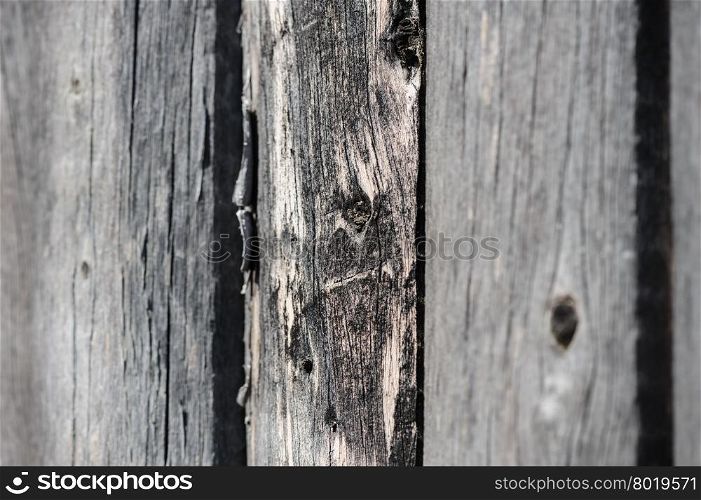 cracked aged weathered wooden boards, selective focus