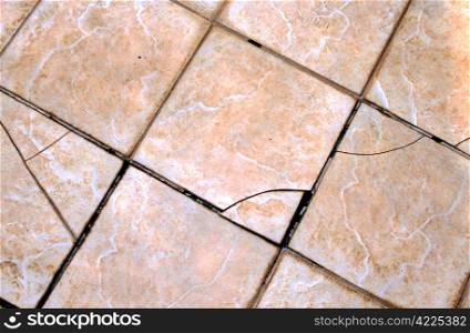 Cracked and Damaged External Tiles Requiring Replacement