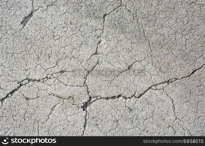 Cracked concrete surface as a background . Cracked concrete surface as a background texture pattern