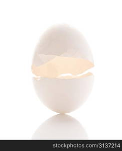 Cracked egg isolated over white