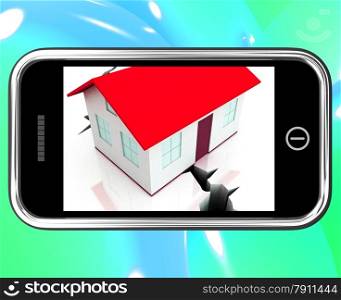. Cracked Foundations On Smartphone Showing Damaged House Or Earthquake