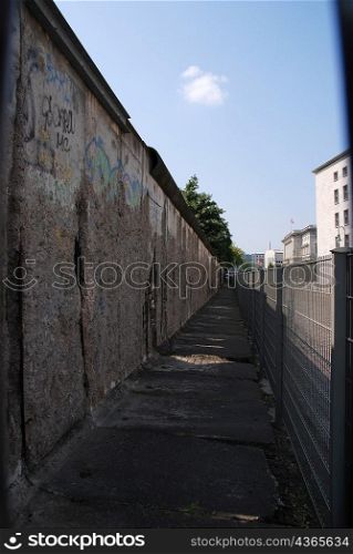 Cracked, graffiti written Berlin wall