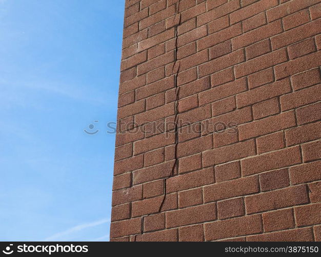 Cracked wall. Crack in a brick wall caused by excessive settling due to bad foundations or too much load or earthquake