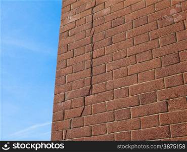 Cracked wall. Crack in a brick wall caused by excessive settling due to bad foundations or too much load or earthquake