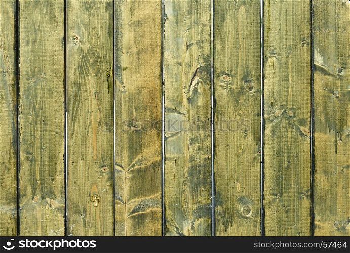 Cracked weathered green and blue painted wooden board texture. The cracked weathered green and blue painted wooden board texture